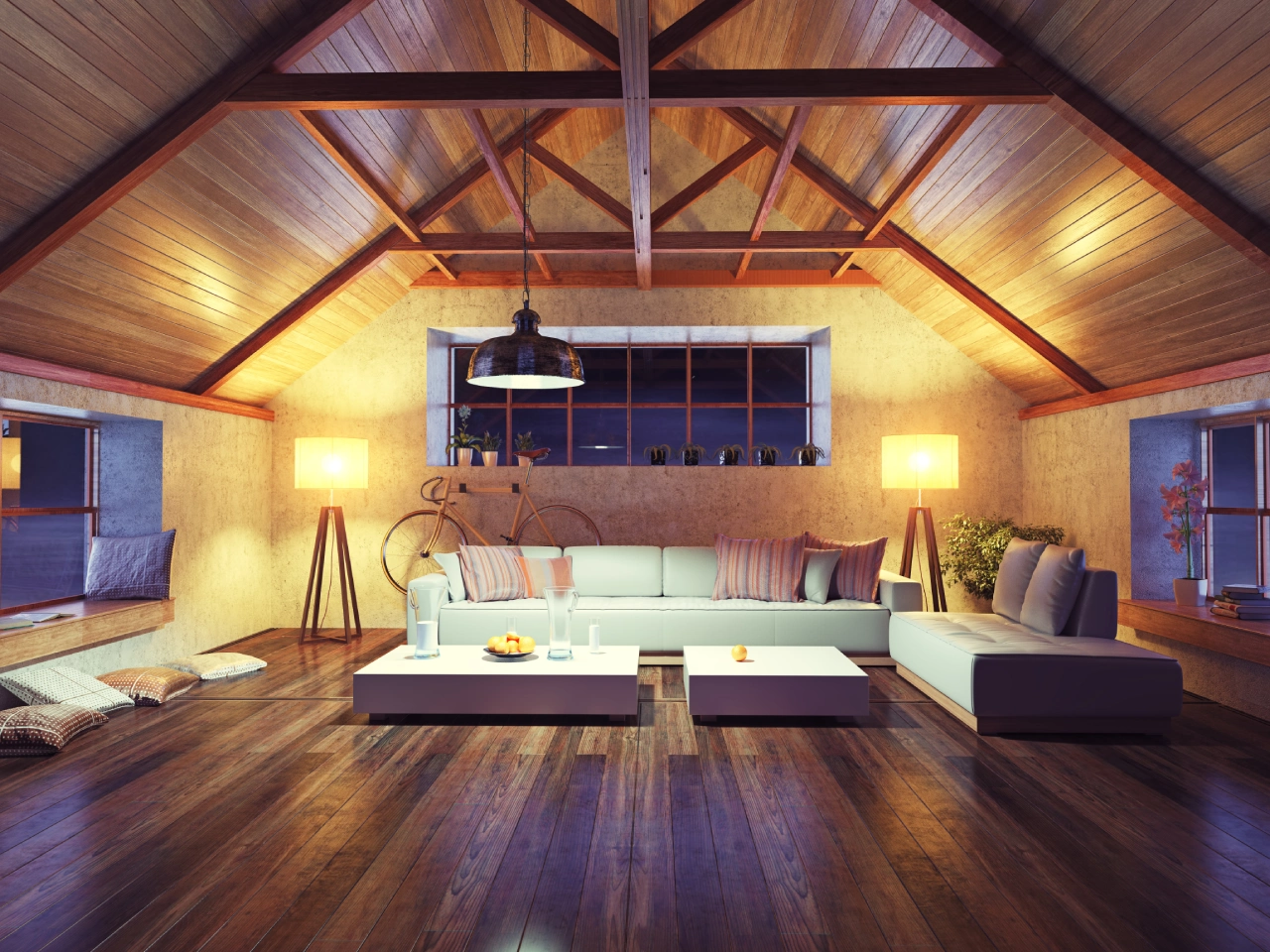 A living room with wooden floors and vaulted ceilings.